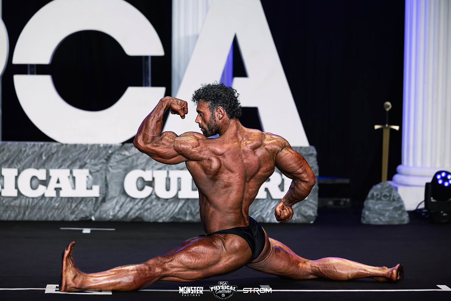Mark Flack PCA Side Lunge Pose Stage