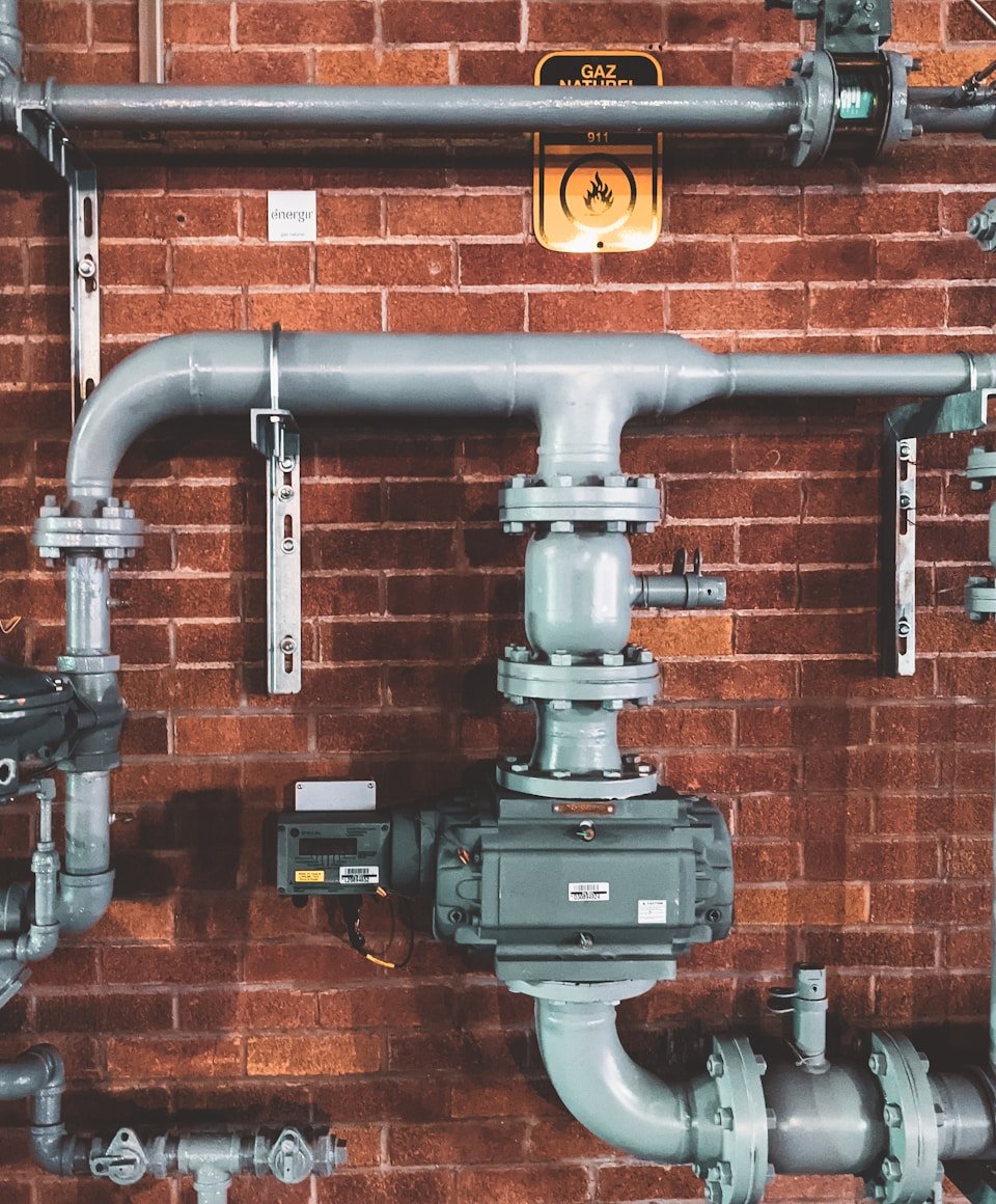 Professional gas engineer working on a modern boiler installation